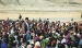 His Highness the Aga Khan walking amongst the crowd at a Mulaquat in Afghan Ishkashim, 27 September 1998. AKDN / Gary Ott