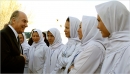 The Aga Khan congratulating graduates of a midwife training course in Afghanistan that was sponsored by the Aga Khan Development