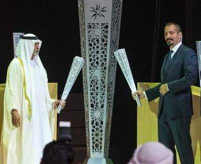 Shaikh Nahyan bin Mubarak Al Nahyan and Prince Rahim Aga Khan light a torch at the opening ceremony 2016-07-23