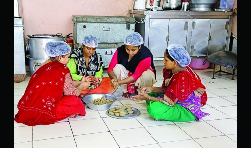 Preparing food at Zaika-e-Nizamuddin, a community kitchen run by local women.