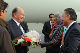 Mawlana Hazar Imam is presented with a bouquet of flowers by AKDN Resident Representative Nurjehan Mawani upon his arrival in Ka
