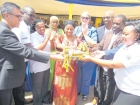 Health, Community Development, Gender, Elderly and Children Minister Ummy Mwalimu cuts the ribbon to officially launch the Mothe