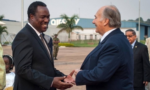 Mawlana Hazar Imam is welcomed by Uganda's Minister of Health, Dr Tumwesigye Elioda, upon his arrival in Kampala. AKDN / Will Bo