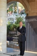 Hazar Imam delivers the keynote address at the Democracy Forum in Athens
