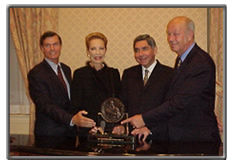 Photo on left: Steven Hilton, Princess Salimah, Dr. Oscar Arias, Helmut Kutin.