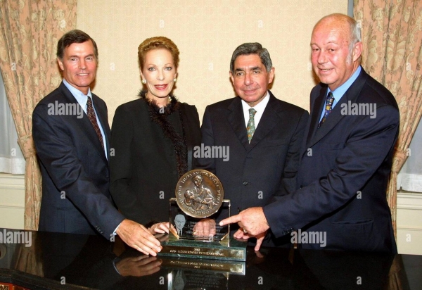 Photo on left: Steven Hilton, Princess Salimah, Dr. Oscar Arias, Helmut Kutin.