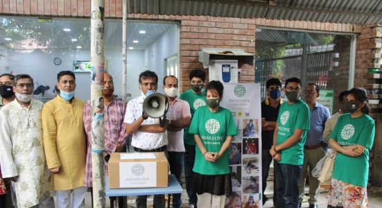 Volunteers from the Ismaili Muslim Community in Bangladesh distribute masks to journalists at Dhaka Reporter's Unity on the occa